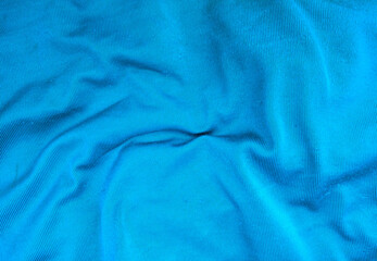 Soft blue satin background. for design background cloth, fabric, template. blurry. wavy