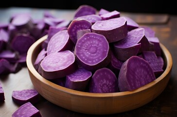 Obraz na płótnie Canvas Sweet purple potatoes in bowl
