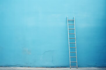 ladder is sticking up from a blue wall