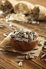 DRİED NUTS AND FRUİTS IN WOODEN BOWL ON BROWN FLOOR
