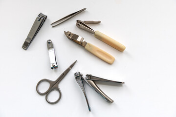Nail clippers and scissor isolated in white.