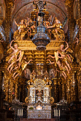 Vertical view of the botafumeiro of the cathedral of Santiago, on its precious altar with gold rivets. Photograph taken in Santiago de Compostela, Galicia, Spain.
 - obrazy, fototapety, plakaty