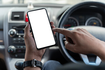 Mockup of man driver hand using blank white screen mobile smart phone inside a car, searching...