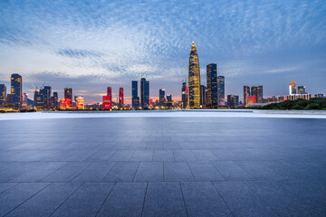 City square and skyline with modern buildings in Shenzhen at night, Guangdong Province, China.