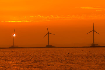 Sunset while looking at the wind farm