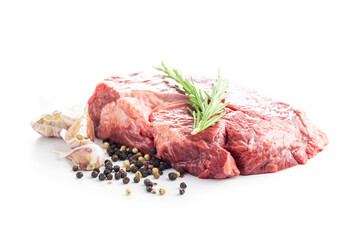 Raw fillet steak beef meat, rosemary, garlic and pepper isolated on white background.