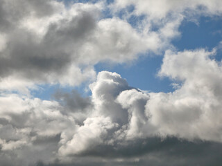 Obraz premium White clouds over blue sky background. Fluffy cumulus cloudscape