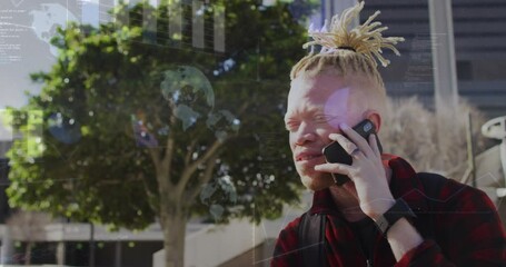 A happy albino african american man with dreadlocks is talking on a smartphone in a park - Powered by Adobe