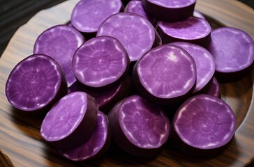 Obraz na płótnie Canvas Purple sweet potato sliced background.