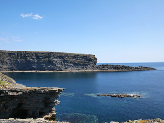 Fototapeta na wymiar Cliffs and Atlantic ocean, rocks and laguna, beauty in nature. Summer vacation trip background