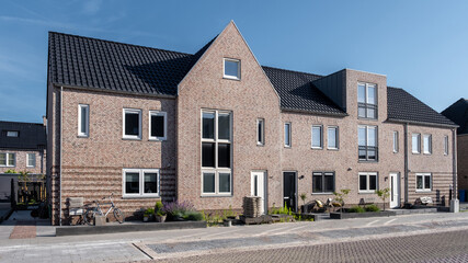 Dutch Suburban area with modern family houses, newly build modern family homes in the Netherlands - obrazy, fototapety, plakaty