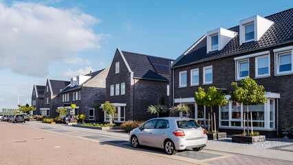 Dutch Suburban area with modern family houses, newly build modern houses in a row - obrazy, fototapety, plakaty