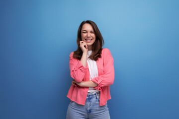 long haired brunette young woman in casual outfit posing over isolated background