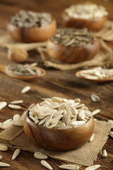 DRİED NUTS AND FRUİTS IN WOODEN BOWL ON BROWN FLOOR