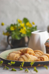 Sweet homemade cakes in close-up, mini bagels on a platter