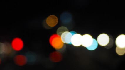 Car headlights blur taken at night on a busy street, Jakarta Indonesia