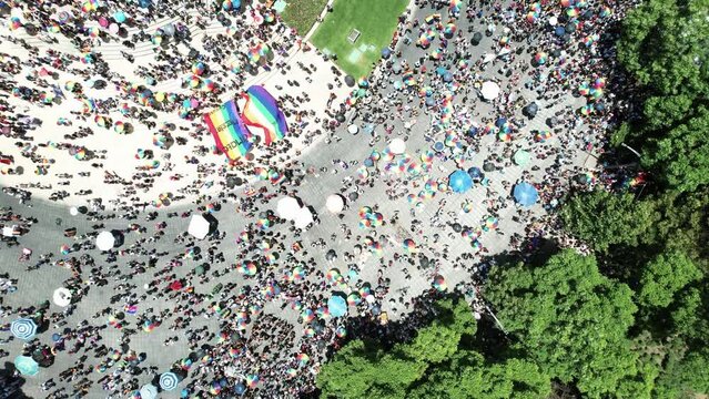 overhead drone shot of people enjoying the pride parade in mexico city at the independence monument