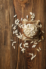 DRİED NUTS AND FRUİTS IN WOODEN BOWL ON BROWN FLOOR