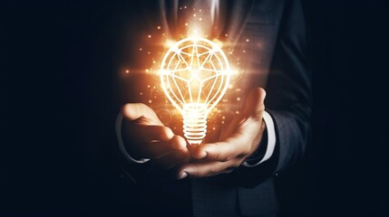 Motivation and innovation Businessman holding light