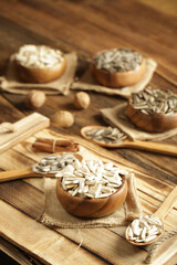 DRİED NUTS AND FRUİTS IN WOODEN BOWL ON BROWN FLOOR