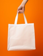 hand holding shopping tote bag