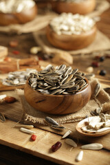 DRİED NUTS AND FRUİTS IN WOODEN BOWL ON BROWN FLOOR