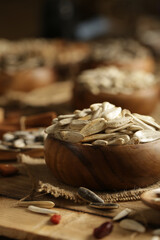 DRİED NUTS AND FRUİTS IN WOODEN BOWL ON BROWN FLOOR