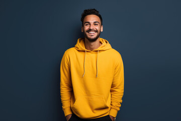 a man wearing a yellow hoodie against a blue background. Generative AI