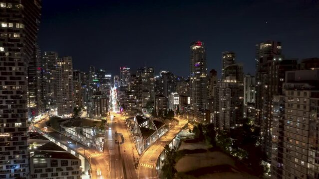 Aerial view of Downtown Vancouver, BC, at night, Granville Street Bridge, city hyper lapse, busy city street, high rise buildings, corporate office, city at night. 4K 24FPS PRORES 422
