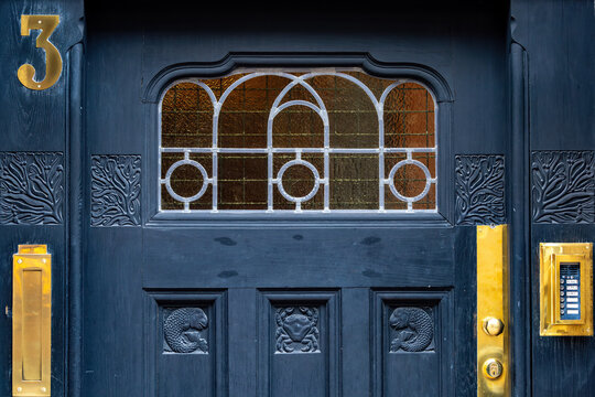 Stockholm, Sweden A detail of an old wooden door in the Larkstaden district of Ostermalm. Doorbell sign indicates floors only.