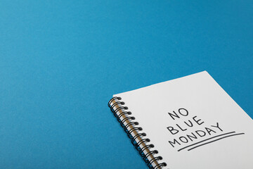Notepad with text No blue Monday on blue background, space for text