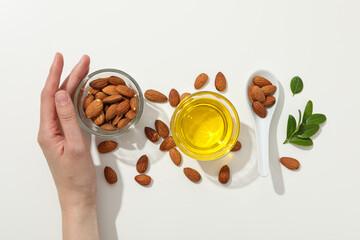 Skin care and body care concept - almonds, almond oil