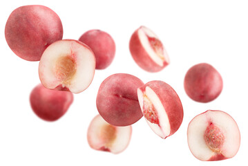 Levitation of pink peaches isolated on transparent background.