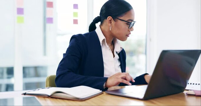 Business woman, typing and planning on laptop for marketing research, website review and copywriting in office. Professional african person or worker reading in glasses on computer for online project
