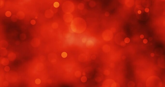 Orange particles and beautiful bokeh. Animation loop of shiny particles. shot with depth of field. golden glitter background