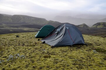 A tent flapping in strong wind. Landmannalaugar, Iceland, Europe. Windy day. 