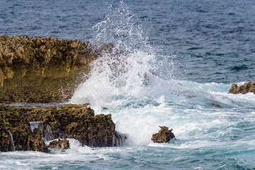 Typical coastline of Bonaire, Dutch Caribbean, with waves crushing on rocks.