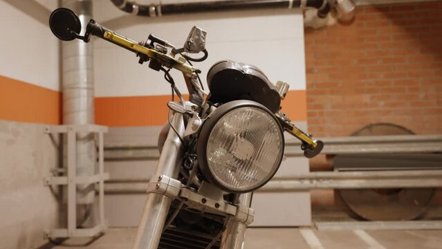 Motorcycle headlight in a garage
