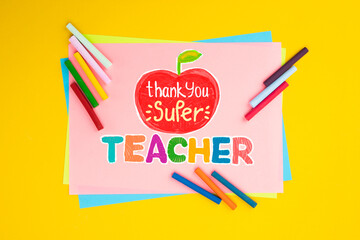 Childish lettering for Teachers' Day. Appreciation of teachers top view flat lay concept. Colored...