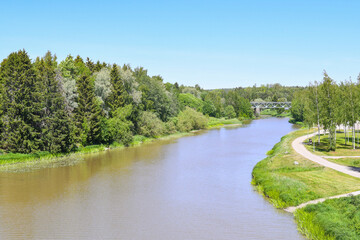 Fototapeta na wymiar Countryside landscape with river in early summer