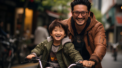 Happy asian father and son riding a bicycle in the city.