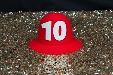 Colorful confetti on red birthday background with a zero. Generative AI