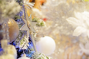 christmas decoration on a branch of a christmas tree. Christmas holiday background