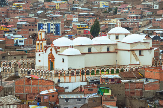 First aboriginal church. Distant view of the ancient San Benito church in Potosi city, Bolivia. Temple with Latin cross and several domes. Southamerica