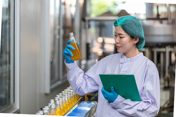 Food factory. Factory inspector controlling production. supervisor or worker using Checking quality...
