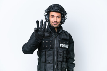 Fototapeta premium Young caucasian SWAT man isolated on white background happy and counting three with fingers