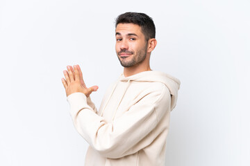 Young caucasian man isolated on white background scheming something