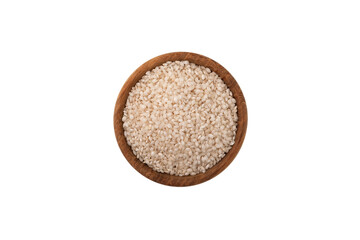 Uncooked Calasparra rice or arroz calasparra in wooden bowl on white background, top view. Spanish processed white rice for paella. Natural Organic Product