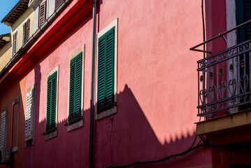 Pink house with green window shutters in the Old Town, Rovinj, Istria, Croatia