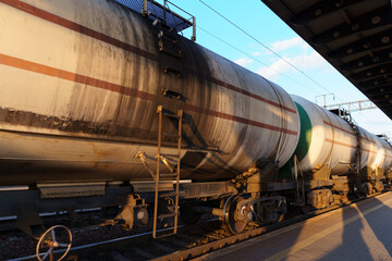 railway tank cars, railroad station platform, concept of freight transportation by rail, industrial cargo transport